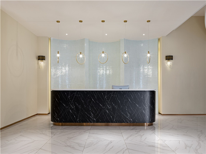 低調奢華風羽妃醫療美容醫院大廳接待吧臺裝修設計實景圖